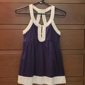 Navy blue tank top with white eyelet trim.